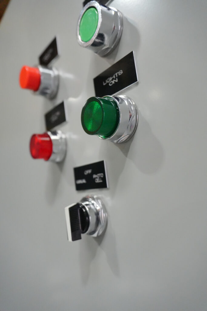 Lighting control panel front buttons